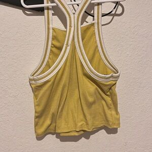 Nice mustard yellow tang top that would look cute with some plain white shorts.